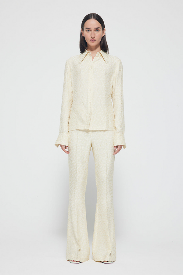 Róhe patterned-jacquard flared trousers - White
